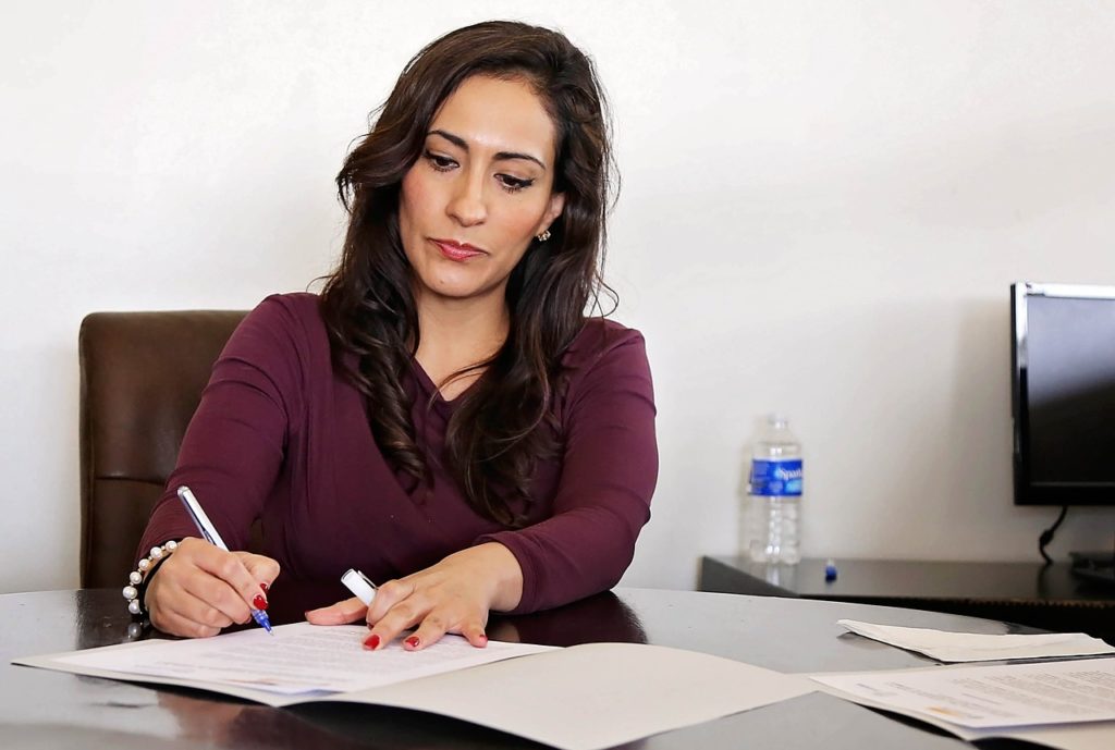 woman signing contract
