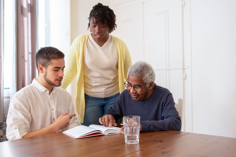 people meeting at a desk